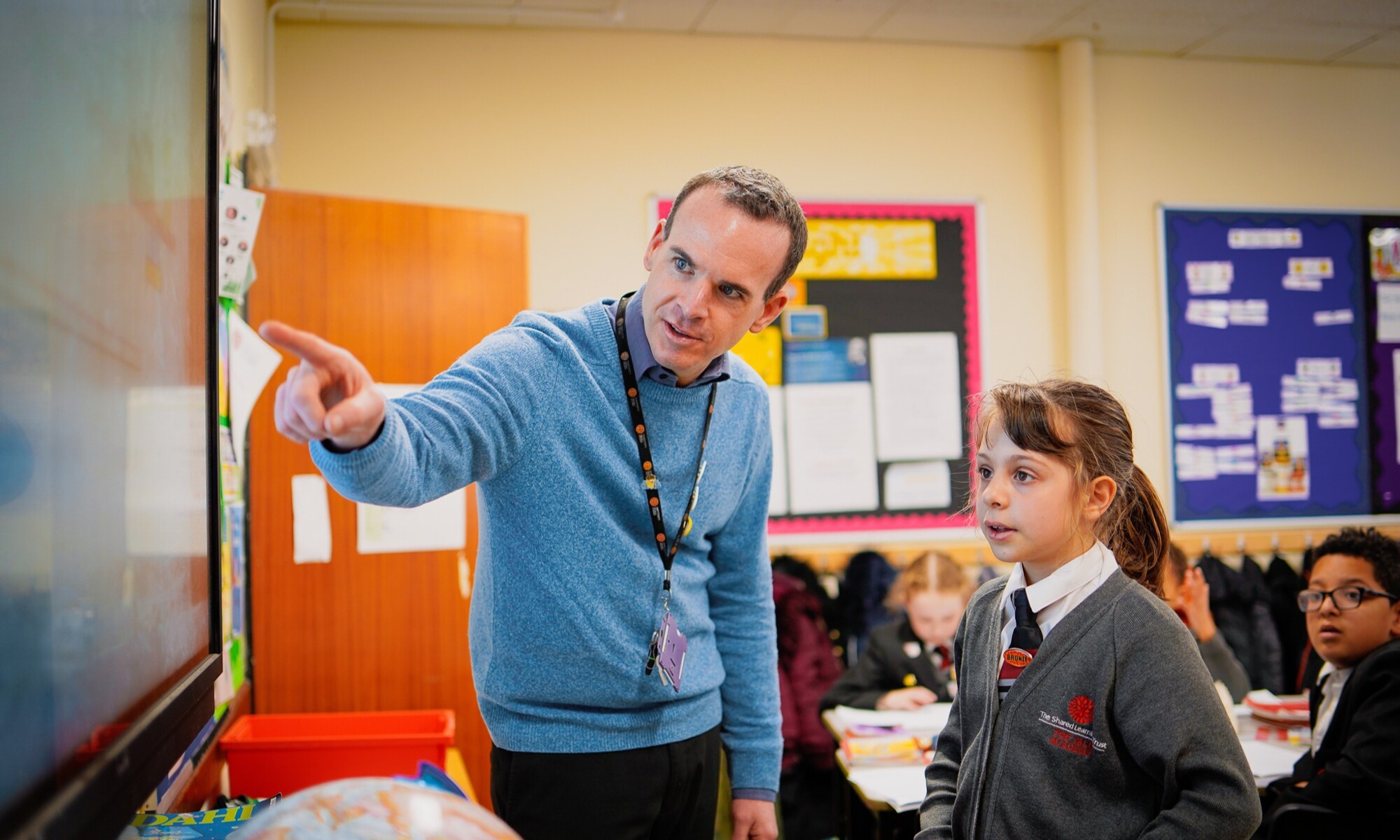 The Vale Academy teacher helping pupil in class